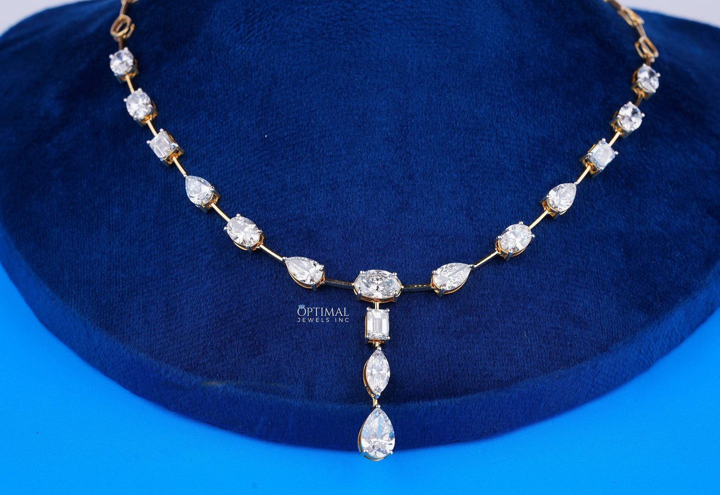 Exquisite Gold Necklace Adorned with Pear, Oval, and Rectangular Cut